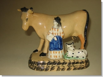 GOOD PRATTWARE COW GROUP, c.1820.