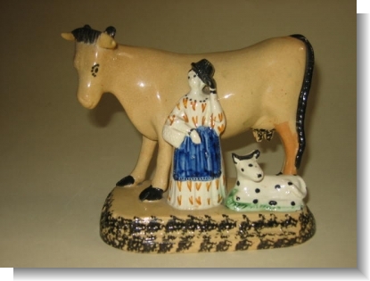 GOOD PRATTWARE COW GROUP, c.1820.
