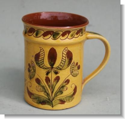 MARY WONDRAUSCH OBE (BRITISH, 1923-2016), A pottery slipware mug
