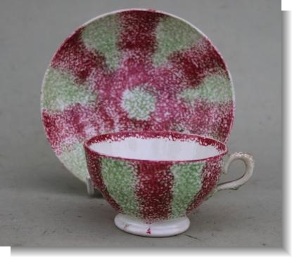 SPLATTER WARE CUP  & SAUCER.
